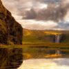 Soloppgang ved flotte Skogafoss., fotokunst veggbilde / plakat av Eirik Sørstrømmen