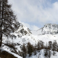 Et vann med fjell i bakgrunnen, fotokunst veggbilde / plakat av Kristoffer Vangen